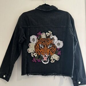 Black raw edged denim jacket with tiger detail on back